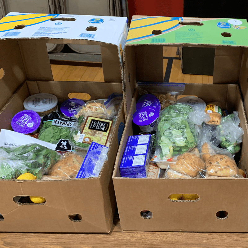 two boxes filled with groceries