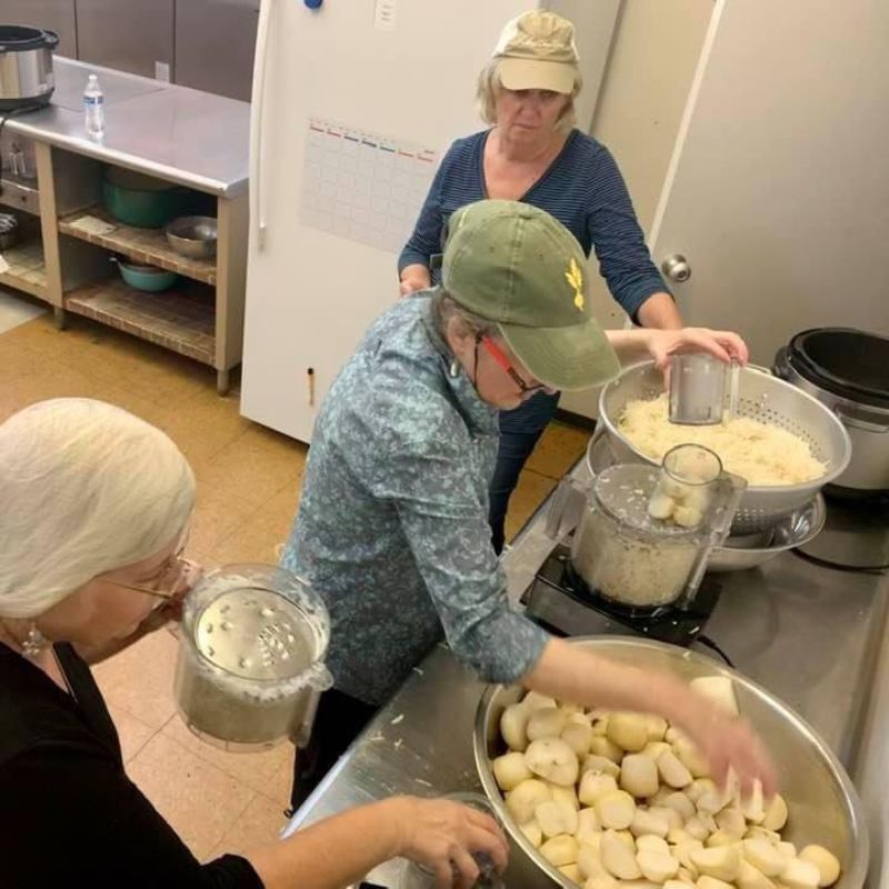 Potatoes being peeled and pureed