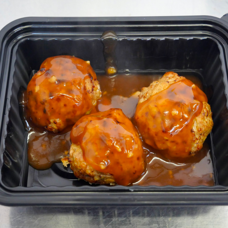 3 glazed meatballs in container
