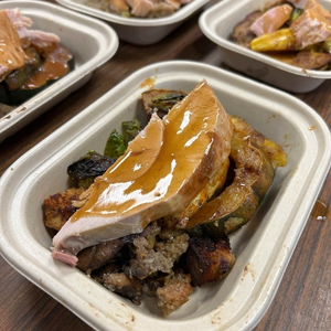compostable container with a turkey dinner for one.